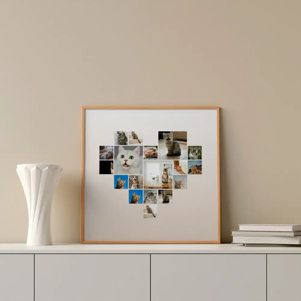 Collage de fotos de gatos en forma de corazón, con marco de madera natural sobre un aparador junto a un jarrón y libros